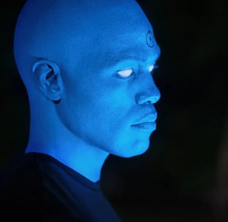 a man with blue eyes and a blue glow