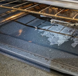 Burnt aluminum folio inside a stove