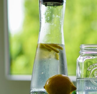 Refreshing detox water with lemon, cucumber, and mint in a glass jar, perfect boosting metabolism