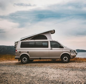 Modern campervan near lake