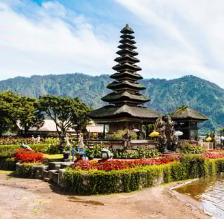 a small island with a pagoda in the middle of it in Bali, Indonesia