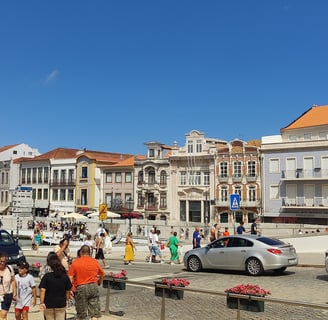 a group of people standing around a city street