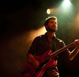 a man with a beard and a guitar