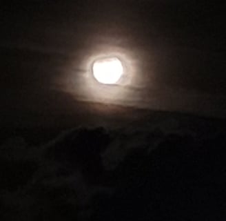 The Lunar Eclipse as seen from Reno, NV on September 18, 2024 with some clouds.