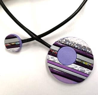 a necklace with a purple and silver necklace