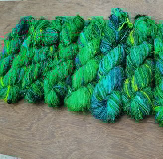 this is fine quality of recycled sari silk yarn. 125 meters of yarn in a 100 gram of skein.