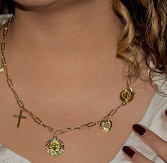 a woman with long hair and a necklace with a heart shaped pendant