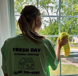 a woman cleaning a window