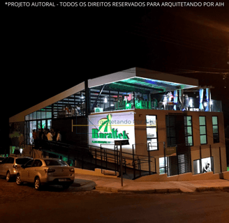 laboratório container sustentável, noturno com luzes e visto em perspectiva