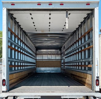 Inside view of box truck cargo area, ready for transporting large items, bulk items, and freight