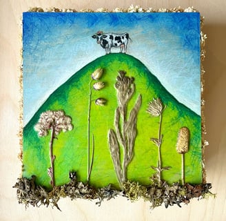 a painting of a cow on a hill with pressed flowers