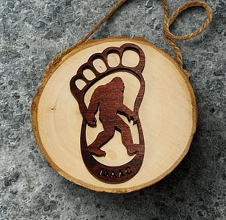 a wooden ornament with a bigfootfootfootfootfootfootfootfoot