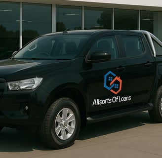 a black truck parked in front of a new car