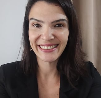 a woman with a black jacket and earrings