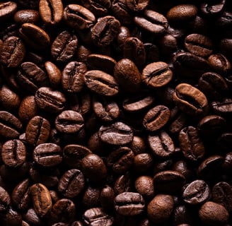 a close up of a pile of coffee beans