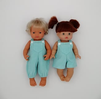 Miniland doll and Minikane doll dressed in handmade overalls
