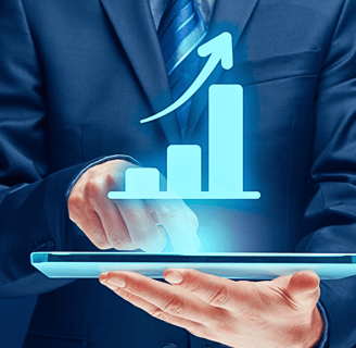 Man in a suit holds a tablet and touches the screen with an index finger as a holographic upward growth bar chart emerges.