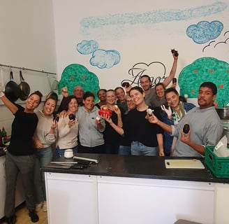 Group photo of smiling volunteers at the local soup kitchen in Portimão, Portugal
