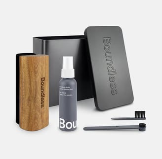 a box of soap with a wooden box and a brush