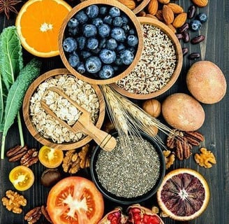 a variety of fruits and vegetables in bowls