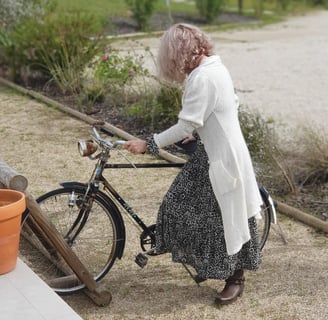 A woman with a vintage bicycle photo