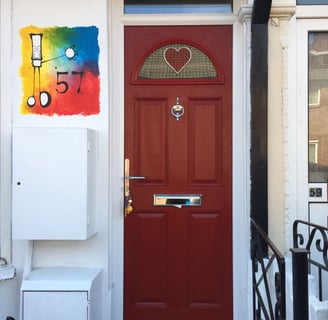 fancy front door for narrow houses. red door with bespoke heart glass