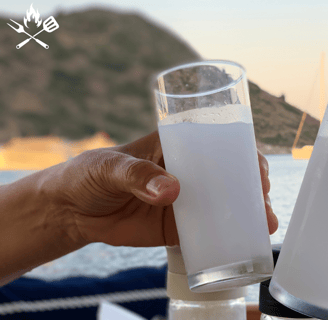 two people toasting Turkish Rakı glasses