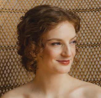 Bride smiling and gazing into the distance.