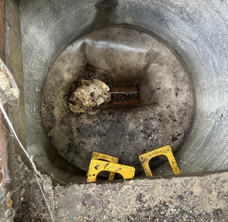 A septic tank being blocked by tissues.