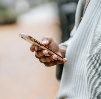Hand holding a phone during an online video consultation with a veterinarian – ideal for pet owners