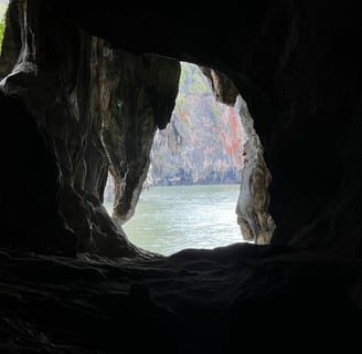 a hole at the end of a cave looks out at the Andaman Sea