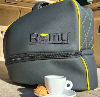 Remy rain cover protecting helmet bag from rain, showing weatherproof fit and outdoor durability