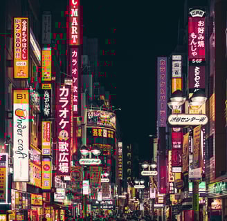 a busy street with many signs in a Tokyo Night