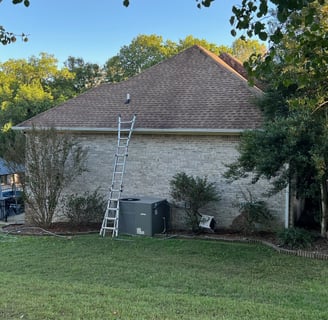 image of a residential shingle roof that has been cleaned using a soft wash method to remove growth