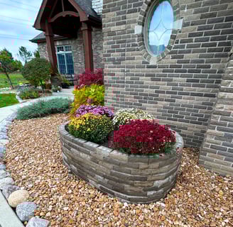 a brick wall with a circular window and a brick wall