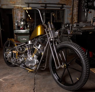 Custom hand built motorcycle parked in a building