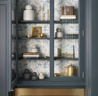 a cabinet with a glass door and a shelf with dishes