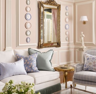 a living room with a couch and a mirror