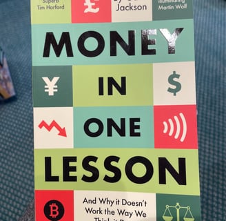 a person holding a book about money