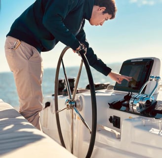 One of our skippers at the helm of our Lagoon 46