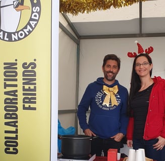 Two members of Portimão Digital Nomads selling mulled wine during Alvor’s Christmas Fair