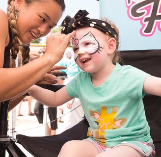 Caroline Face Painting a Hello Kitty at a Park in Las Vegas