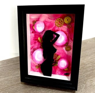 a picture of a woman silhouetted against a pink flower