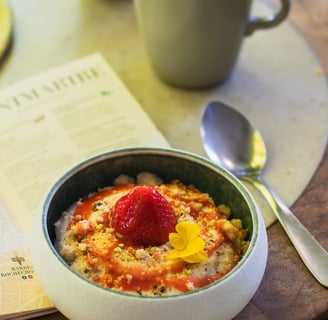 a bowl of oatmeal with a strawberry pie