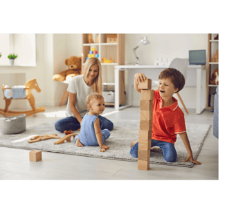 Mum and two young children playing with toys on the floor 