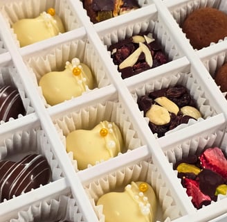 Gourmet Artisanal Assorted Chocolates including dark, milk, white chocolate, and truffles from Chocos Cookies Cakes