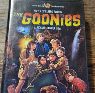Alt text: Sealed vintage VHS of The Goonies, a classic 80s adventure film.