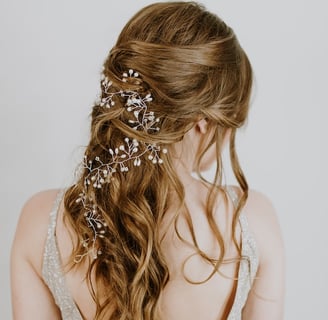 a woman with a wedding hair comb and a flower in her hair
