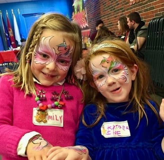 Two Unicorn Mask Face Paintings at a Holiday Event in Las Vegas