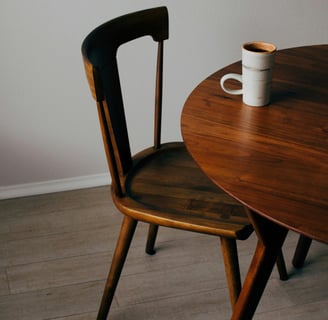 a coffee cup and a mug of coffee on a table